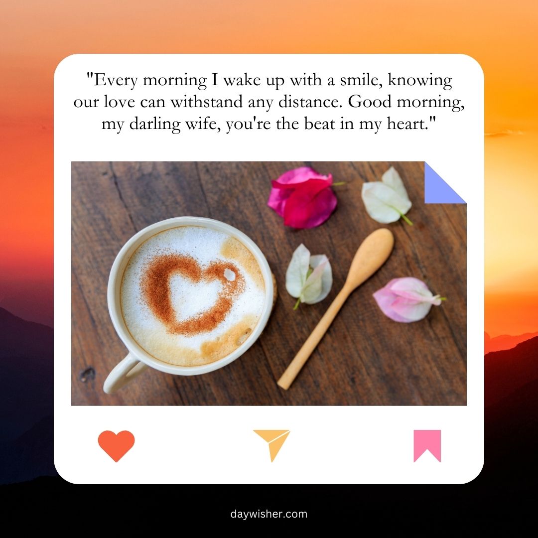 A cup of coffee with a heart-shaped foam design, accompanied by a wooden spoon and a pink rose petal, set on a wooden surface. In the background, a sunrise over mountains, adorned with
