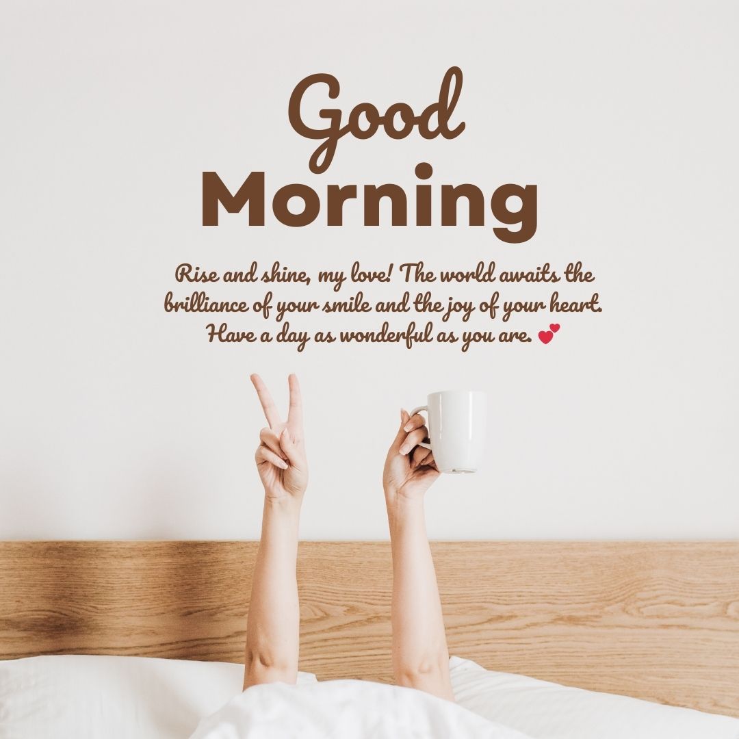 A person in bed holding a coffee mug, making a peace sign with their hand, with the text "Good Morning Messages" and an inspirational quote above them on a plain wall.