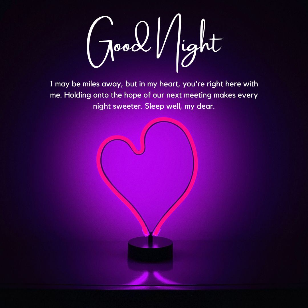 A heartfelt good night message for him with a glowing pink neon heart lamp, emphasizing affection despite long distance. The text conveys longing and anticipation for the next meeting.