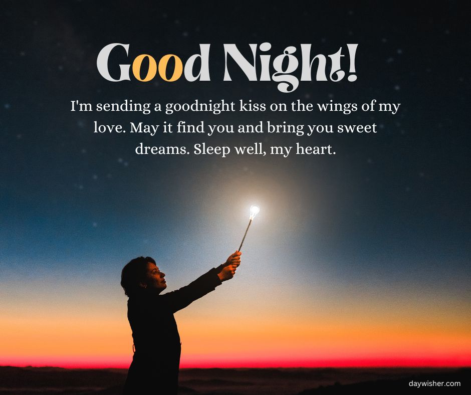 A person holding a lit sparkler against a twilight sky with stars, with text saying "Good Night! Even from afar, I'm sending a goodnight kiss on the wings of my love. May