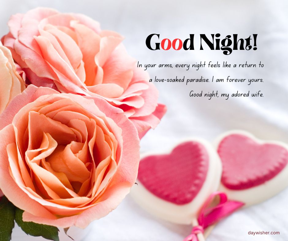 An image of peach roses and two heart-shaped cookies with a Good Night Messages For Wife expressing love and devotion to a wife. The background features soft white fabric.
