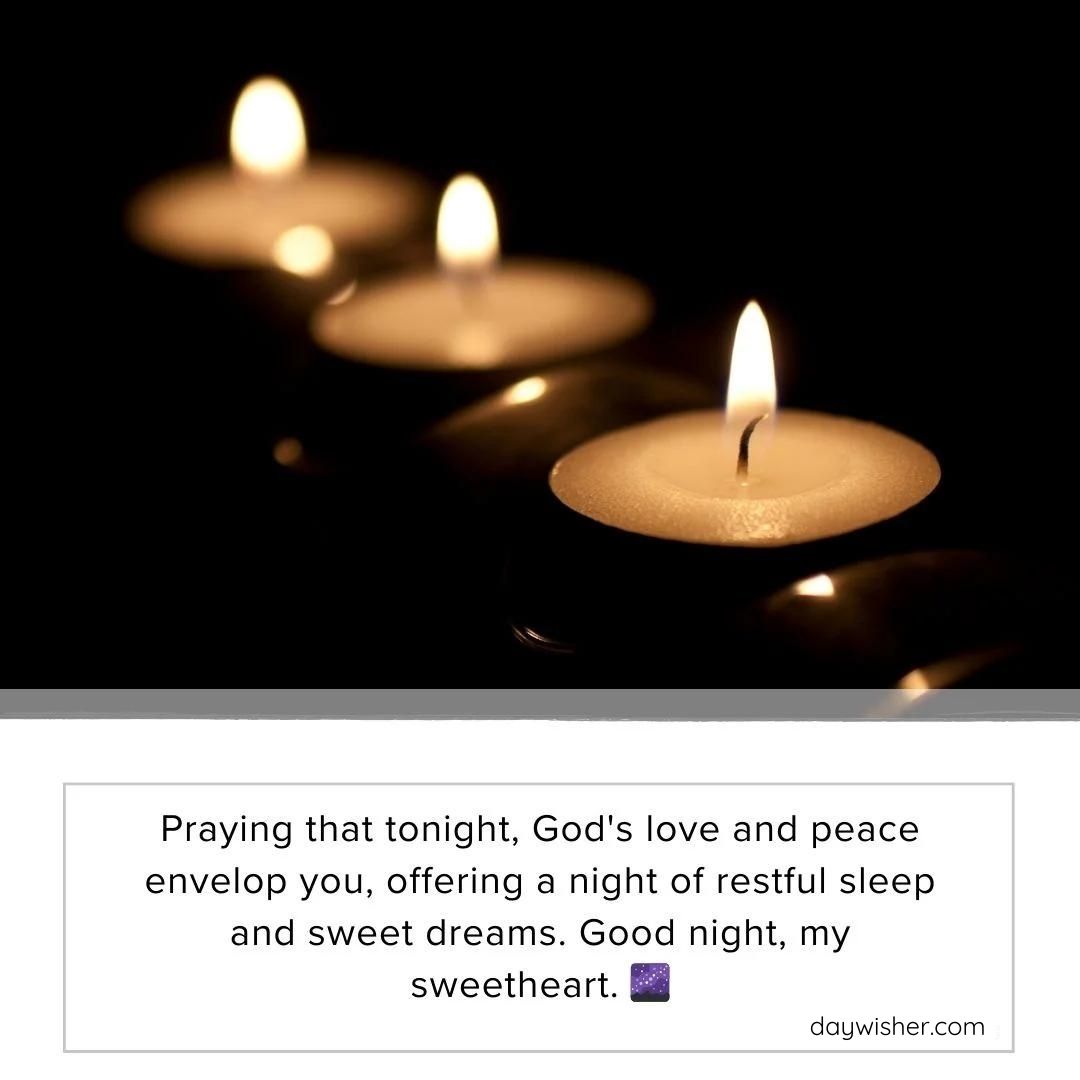 Three lit candles in a dimly lit environment with a good night prayer wishing for God's love, peace, and sweet dreams.