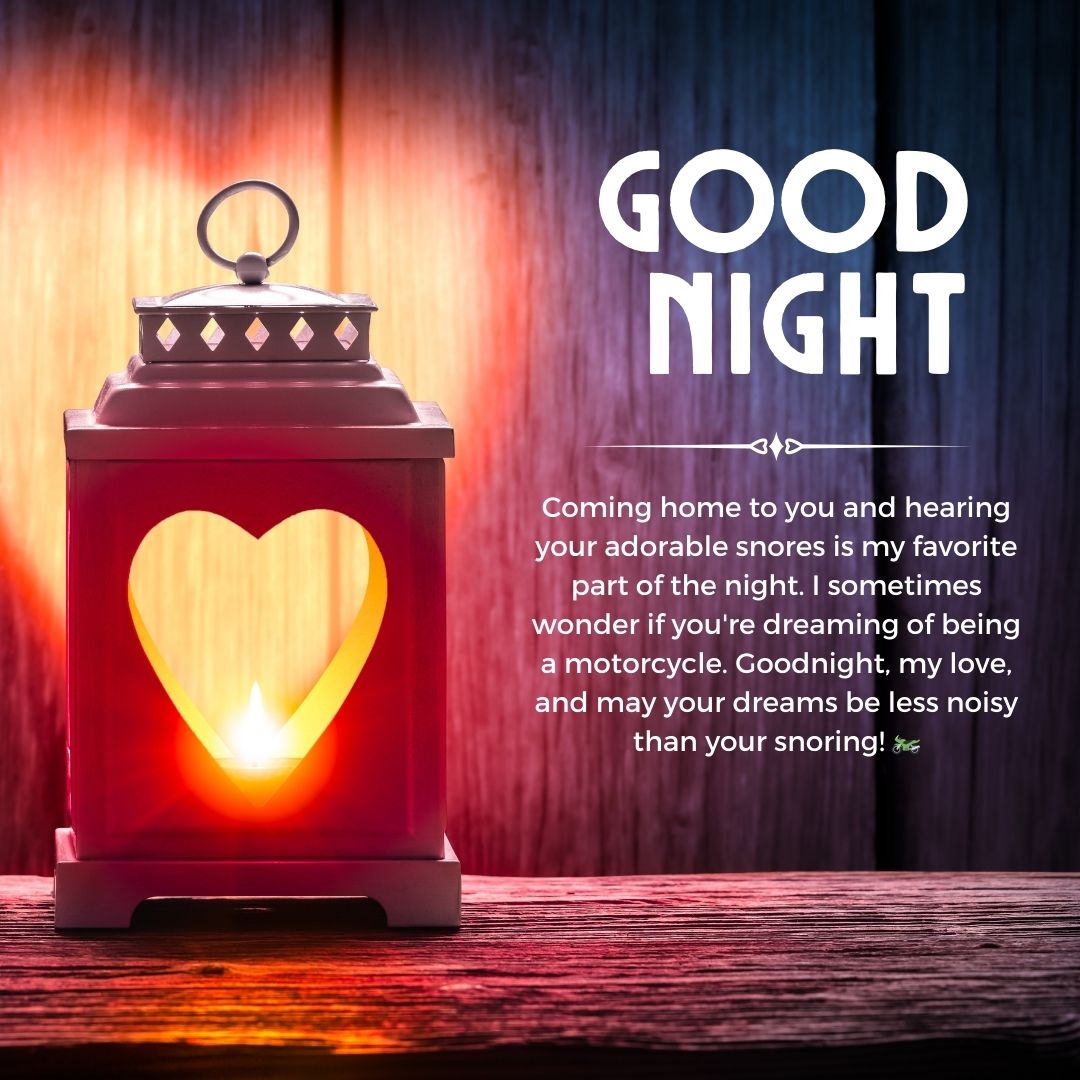 A red lantern with a heart-shaped cutout illuminated from within, set against a wooden background. Text above reads "good night" in white lettering with a sweet, humorous message below about snoring
