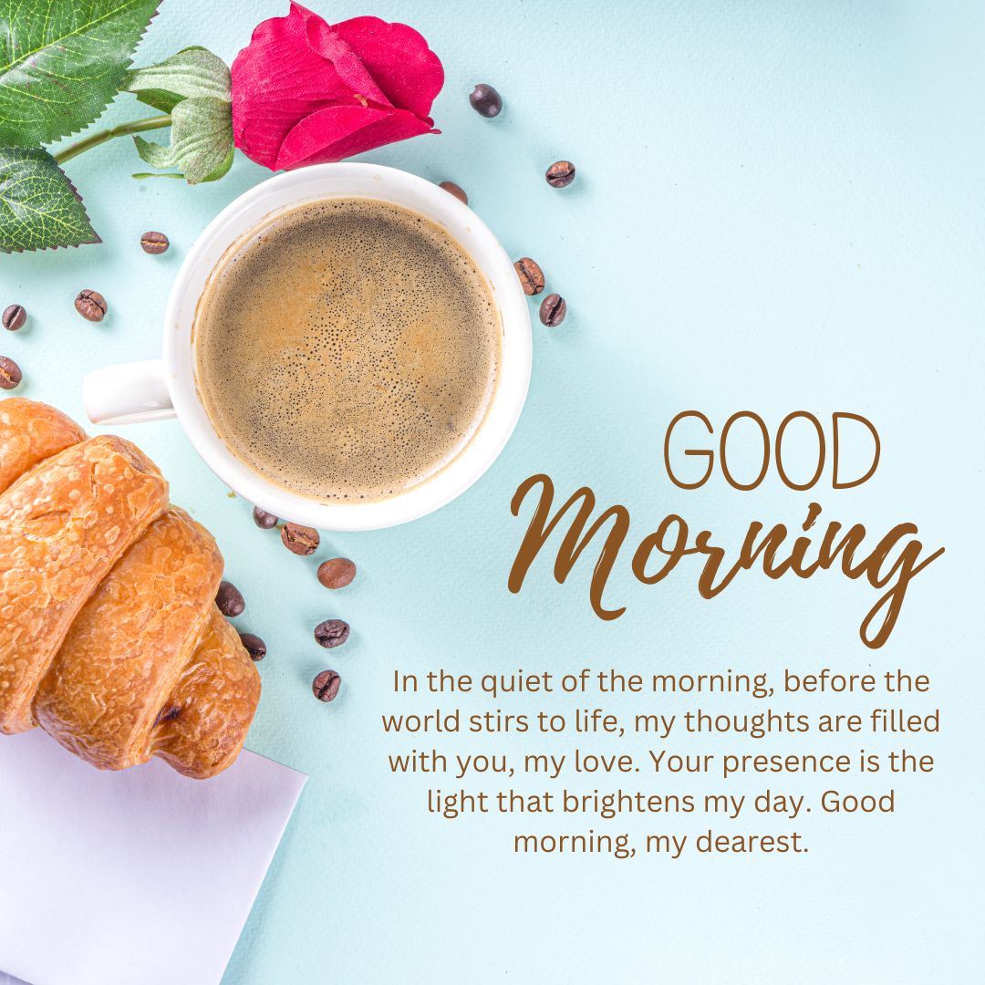 A serene breakfast scene featuring a cup of coffee, a croissant, coffee beans scattered around, a pink rose, and a note containing Good Morning Messages with a romantic touch.