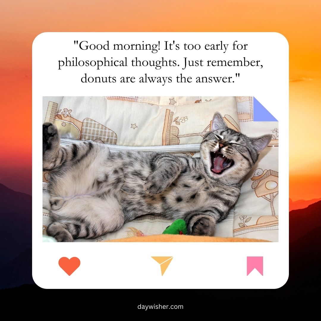 A tabby cat yawning while lying on its back on a bed, surrounded by colorful pillows, with a sunrise in the background and a funny quote about donuts.