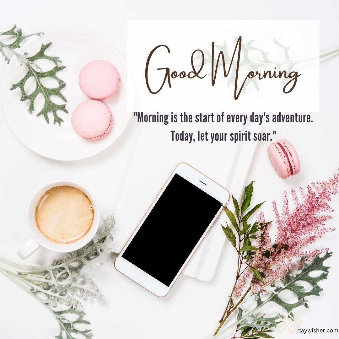 Flat lay featuring a "good morning" message with quotes, a cup of coffee, pink macarons, a smartphone, and floral decorations on a white background.