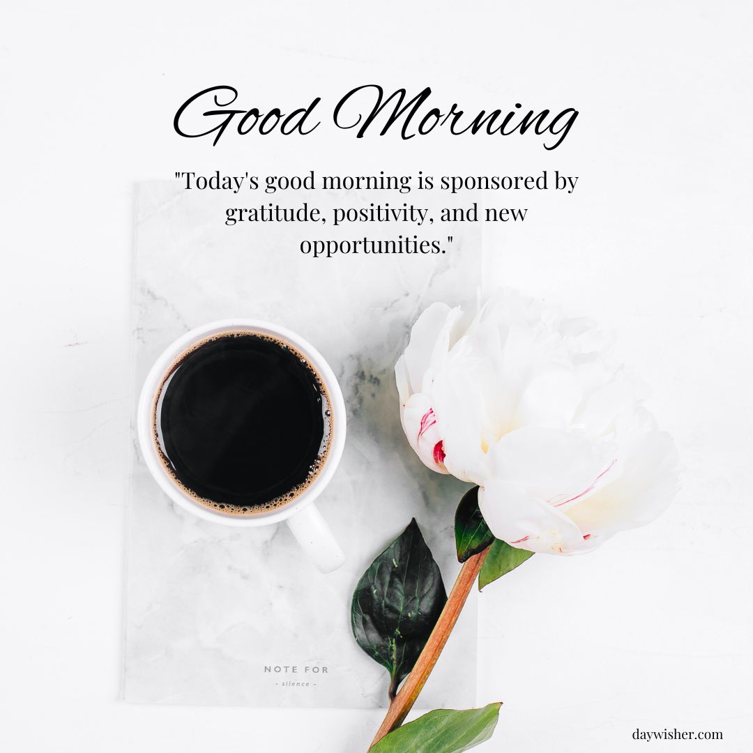 A cup of coffee and a white peony flower are placed on a marble surface next to a card with "Good Morning Images with Quotes" about gratitude and positivity.