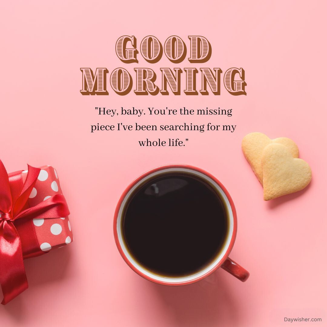 A warm "Good Morning Love" greeting above a cup of black coffee, with a heart-shaped cookie and a gift wrapped in red polka dot paper on a pink background.