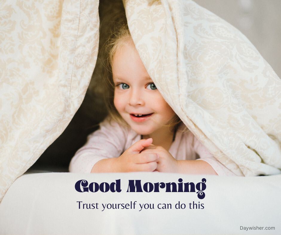 A young girl with blonde hair peeks out smiling from underneath a white blanket with the text "today special good morning - trust yourself you can do this" overlaid.