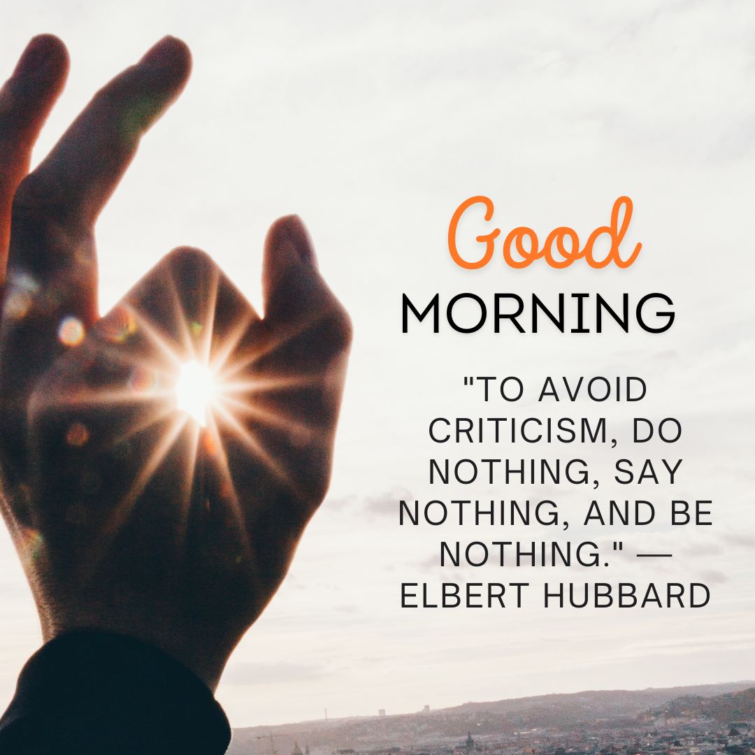 A hand catches the sunlight forming a heart shape, with a sunrise in the background and an inspiring quote by Elbert Hubbard that reads: "Good morning 'to avoid criticism, do nothing, say nothing