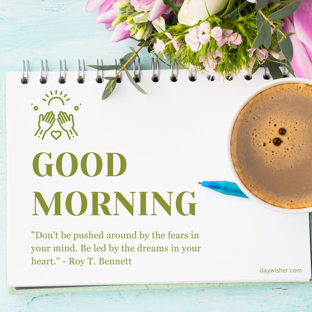 A motivational Good Morning image featuring a notepad with a quote, a cup of coffee, and a bouquet of pink flowers, promoting positivity and inspiration.