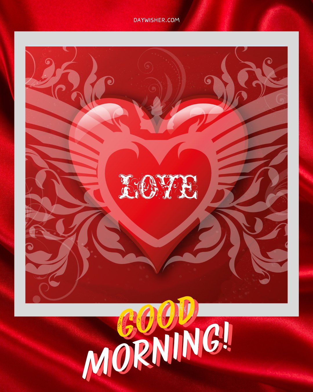 A vibrant good morning heart image featuring a large red heart with the word "LOVE" in white, stylized with decorative patterns and wings. The background is a rich red fabric texture, adding a touch of elegance. Below the heart, the cheerful text "Good Morning!" is displayed in bold, colorful letters. This captivating image is perfect for sending heartfelt morning greetings.