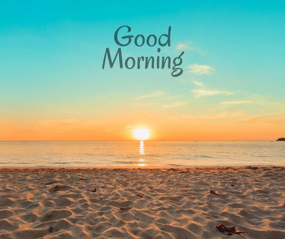 A tranquil beach at sunrise with a golden sun rising over the calm sea, casting a warm glow on the sand. The image features the text "Good Morning," creating a serene and uplifting start to the day. Ideal for good morning nature images, HD quality, and beautiful landscapes to inspire peace and positivity.