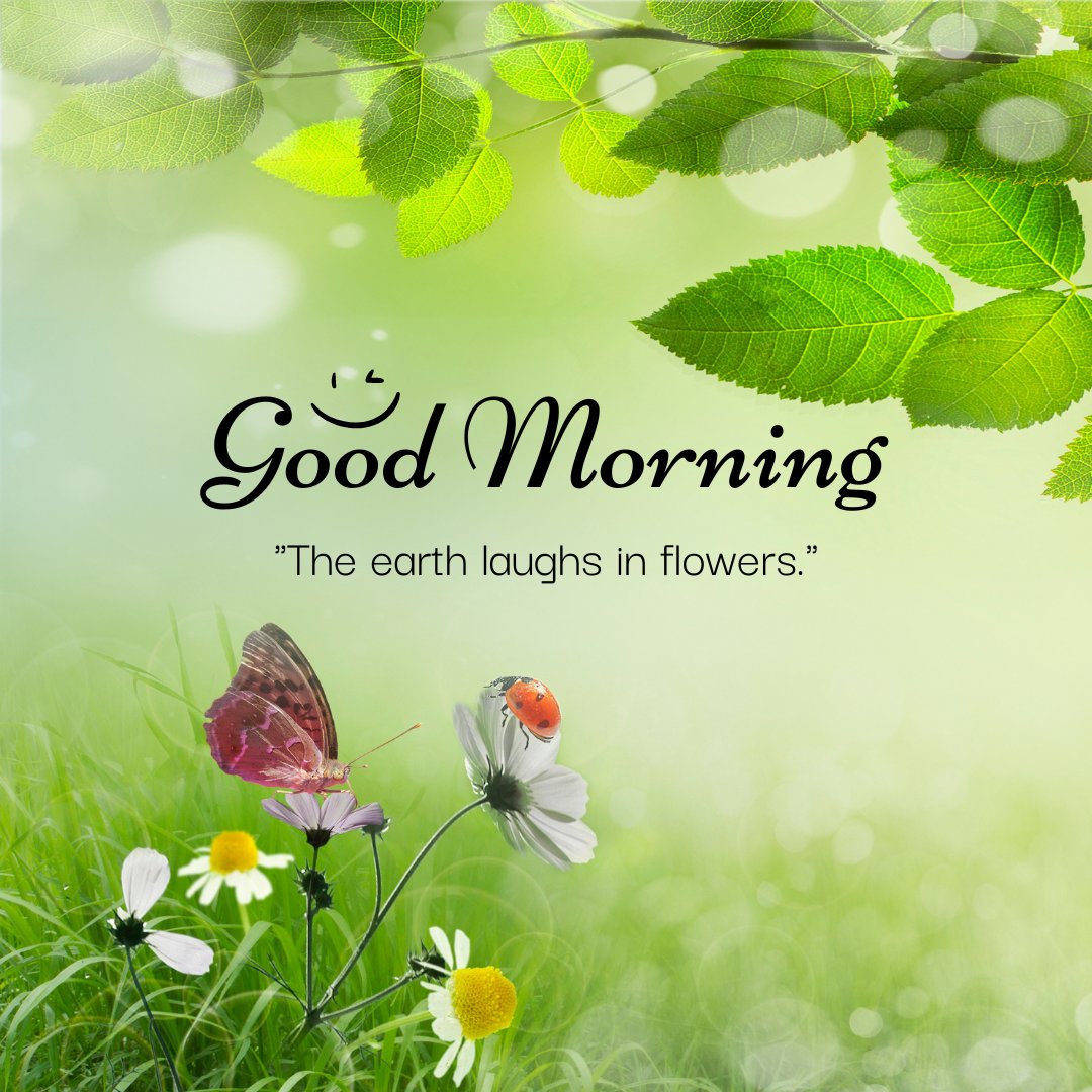 A delightful good morning image featuring a close-up of wildflowers with a butterfly perched on one and a ladybug on another. The background is a soft blur of green foliage and sunlight filtering through the leaves. The text "Good Morning" is written in an elegant font with a smiley face illustration. The quote "The earth laughs in flowers" accompanies the scene. This image captures the beauty and joy of nature, perfect for a cheerful and refreshing morning greeting.