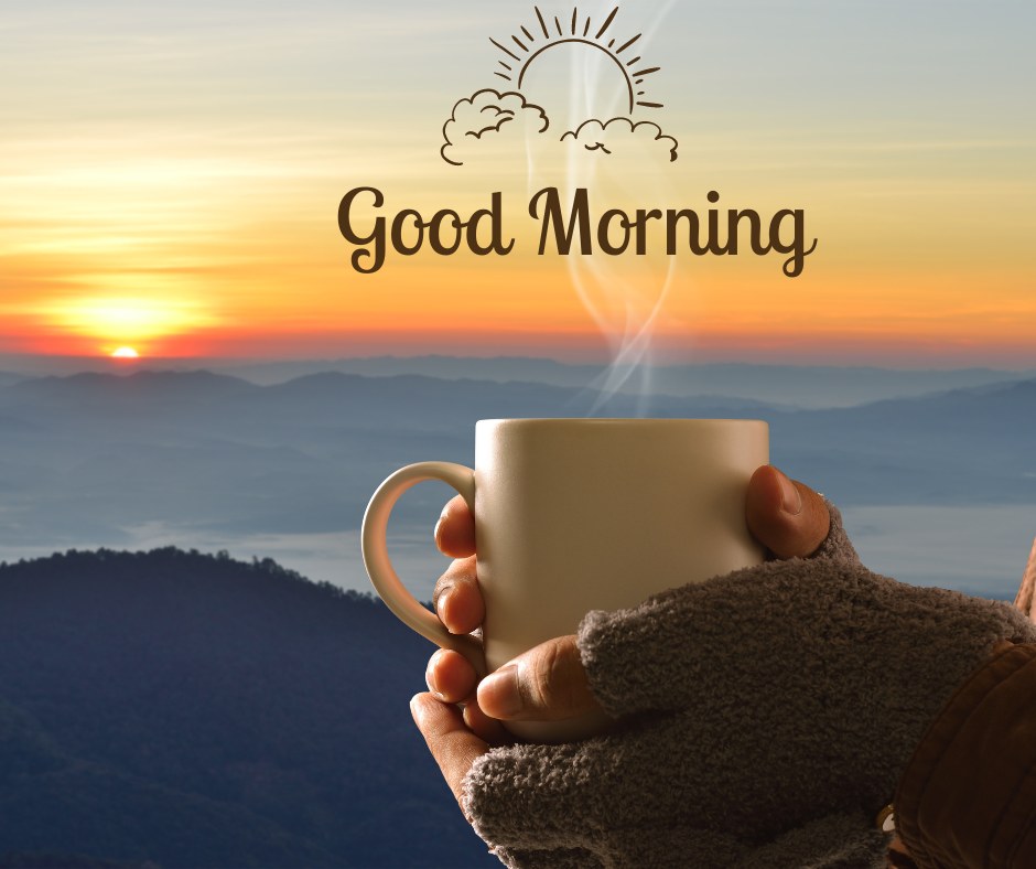 A cozy good morning image featuring a person wearing gray gloves, holding a steaming cup of coffee against the backdrop of a beautiful sunrise over misty mountains. The text "Good Morning" is written in a charming font with a sun and cloud illustration above it. The scene captures the warmth and tranquility of enjoying a morning coffee while appreciating nature's beauty, perfect for a soothing morning greeting.