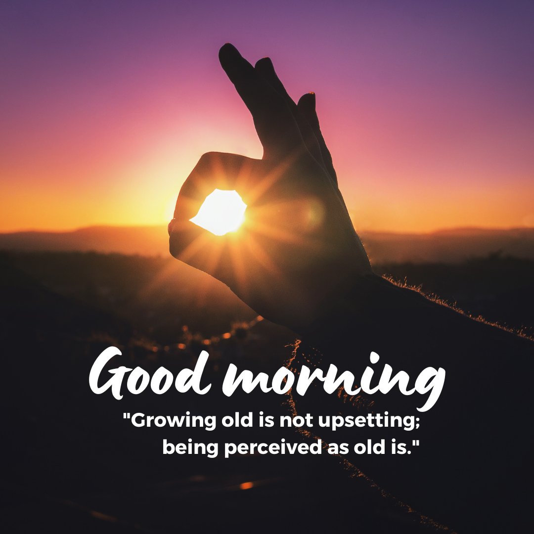 A beautiful good morning image featuring a silhouette of a hand making an "OK" gesture with the rising sun shining through the circle formed by the fingers. The sky is a gradient of purple and orange hues, creating a serene and inspiring scene. The text "Good Morning" is written in a stylish font, accompanied by the quote "Growing old is not upsetting; being perceived as old is." This image captures the peacefulness and inspiration of a sunrise, perfect for a motivational morning greeting.
