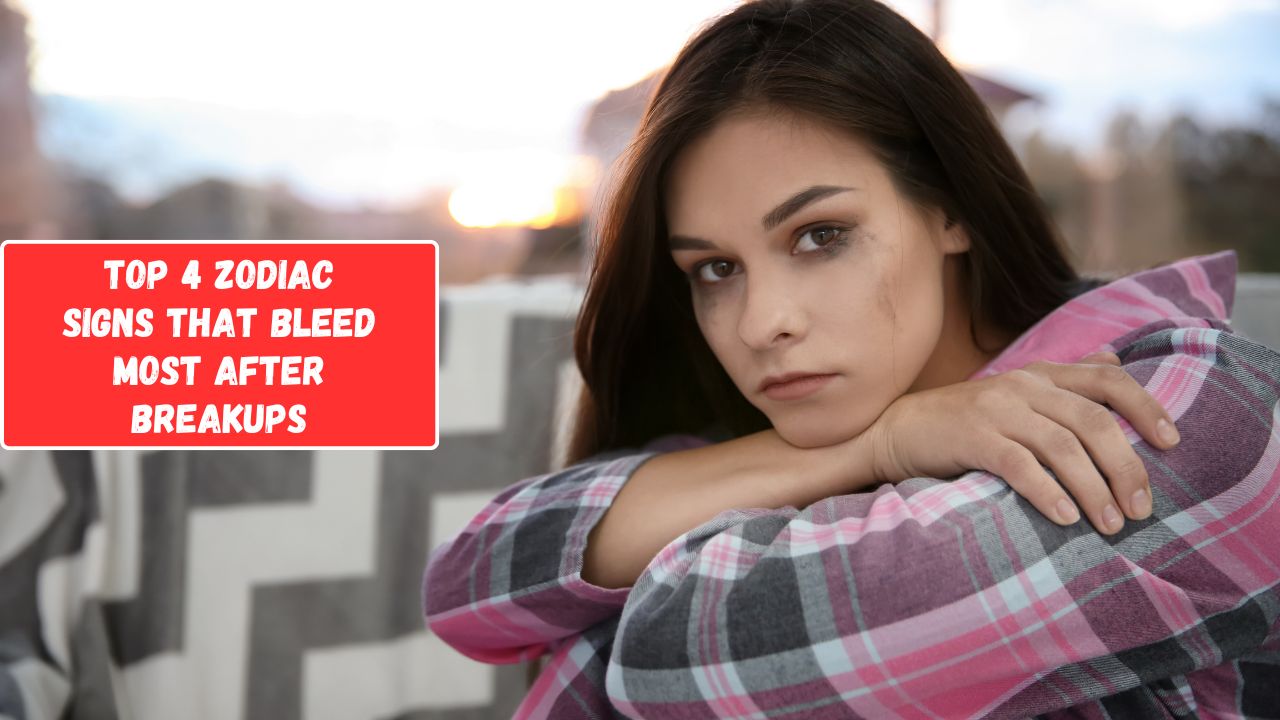 A somber young woman with dark hair sits with crossed arms, wearing a plaid shirt. She appears pensive against a blurred background with text overlay: "Top 4 zodiac signs that bleed