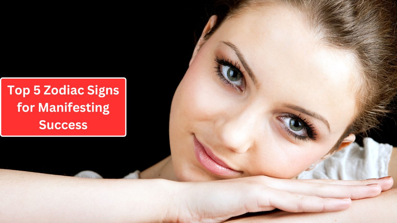 A woman with a contemplative smile rests her chin on her hand against a black background, with a red text box reading "top 5 zodiac signs for manifesting success.