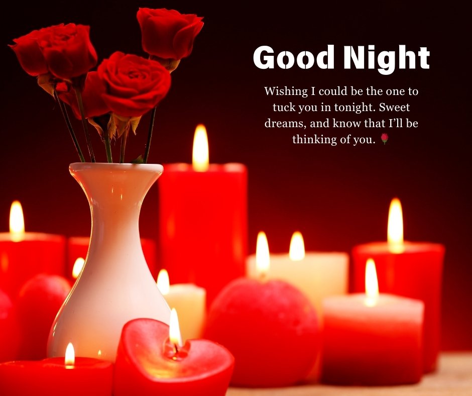 A romantic scene featuring red roses in a white vase surrounded by lit red candles. The message reads, "Good Night. Wishing I could be the one to tuck you in tonight. Sweet dreams, and know that I’ll be thinking of you. 🌹" Perfect for a romantic good night message for crush.
